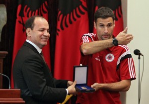 epa04975259 Albanian President Bujar Nishani (L) awards Albanian national soccer team Captain Lorik Cana (R) with the Medal of Honour in Tirana, Albania, 12 October 2015. Thousands of Albanians turned out in the capital Tirana to welcome the national football team after it secured the country's first-ever place at a major finals. Albania the previous day secured second spot in Euro 2016 qualifying Group I with a 3-0 win away to Armenia. EPA/FLORION GOGA